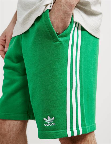 adidas shorts green stripe.